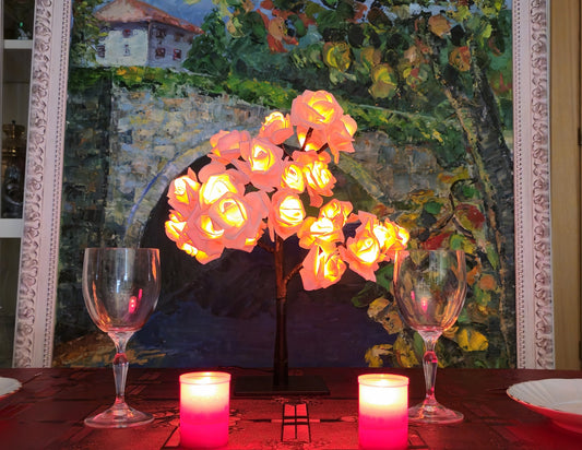 NoVa Premium Illuminated Tree Lamp with various illuminated leaves and roses in different colors.
